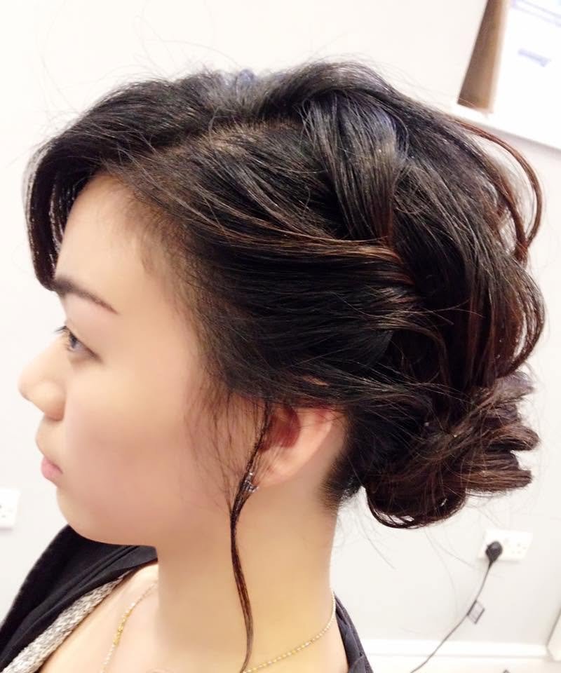 A soft curled up-do with loose face-framing pieces